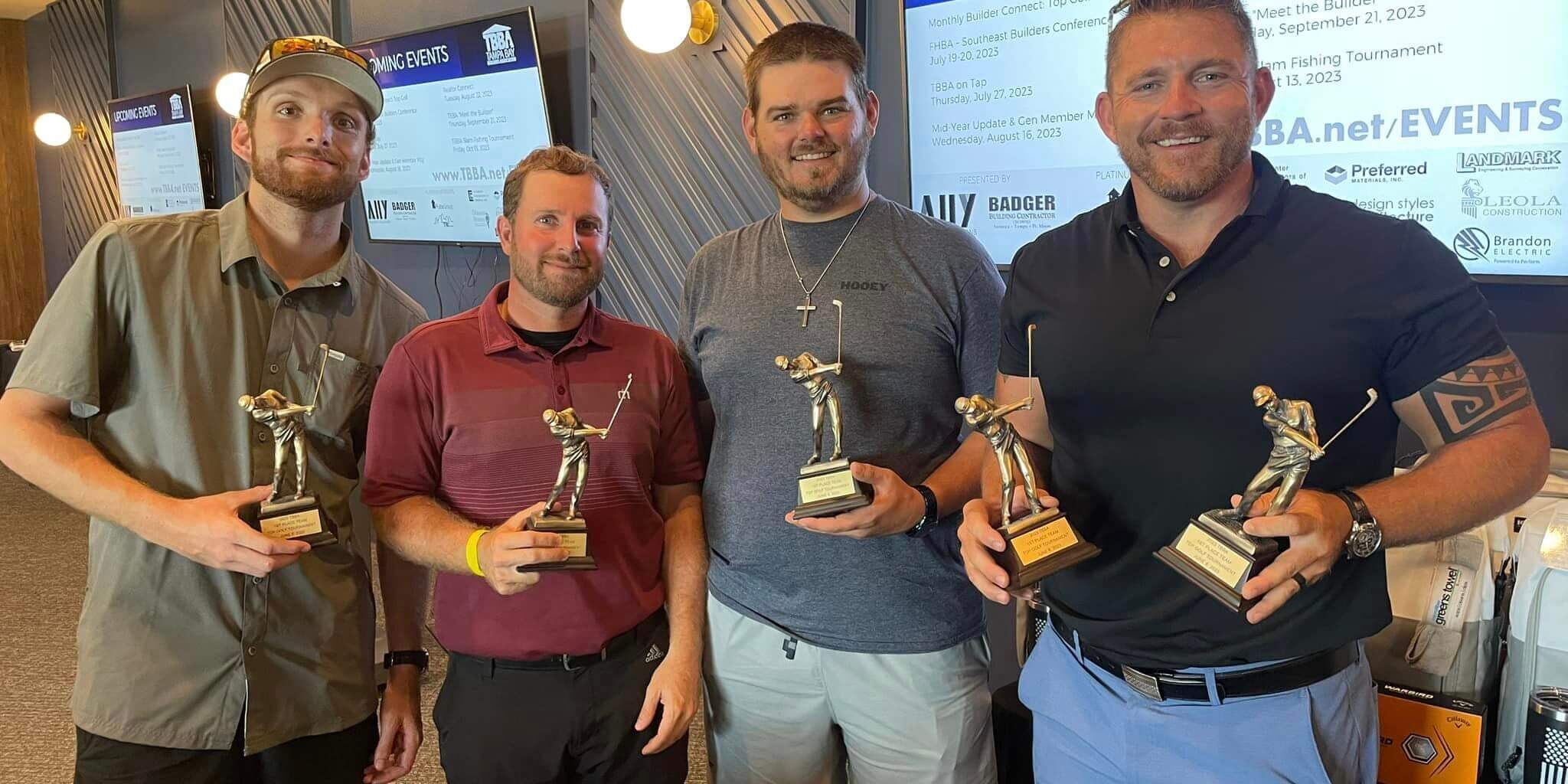 group of people posing for photo with trophies